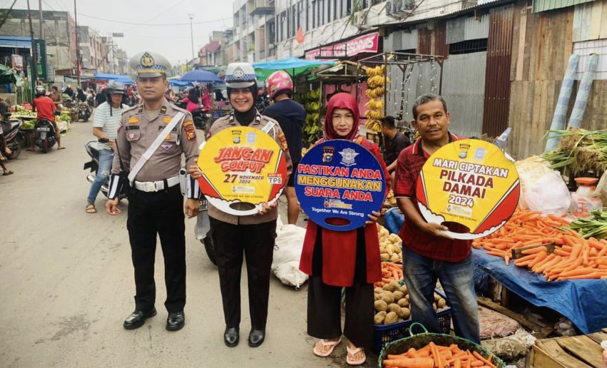 Satlantas Polresta Pekanbaru Sosialisasi Pilkada Damai di Pasar Kodim